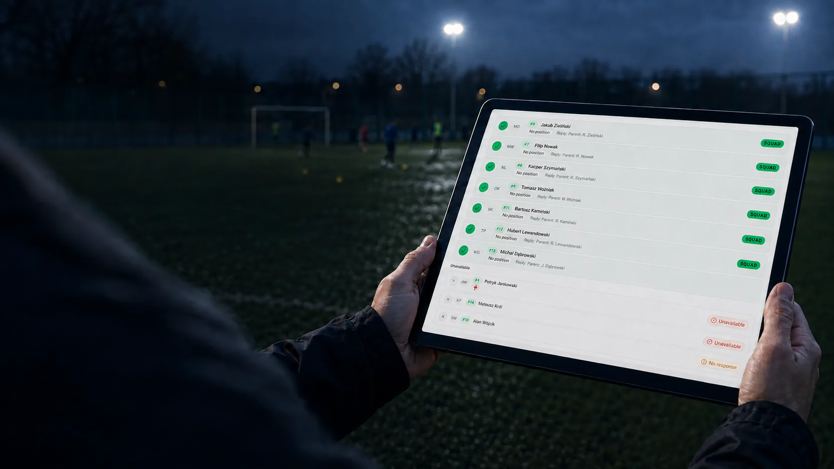 A football coach checking player availability in TrainTeam before a match